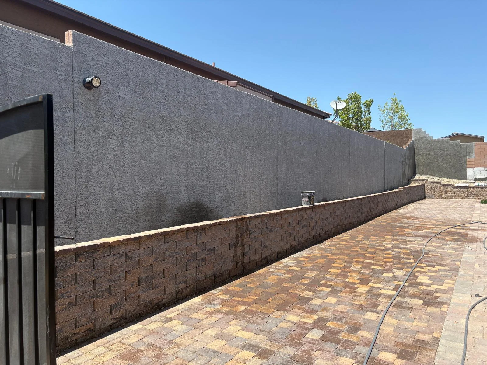 Paver walkway along a stucco block wall in Las Vegas, NV